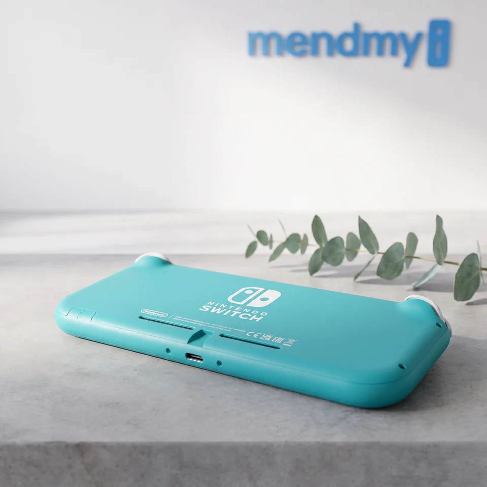 Person holding a turquoise Nintendo Switch Lite 32GB as a handheld games console