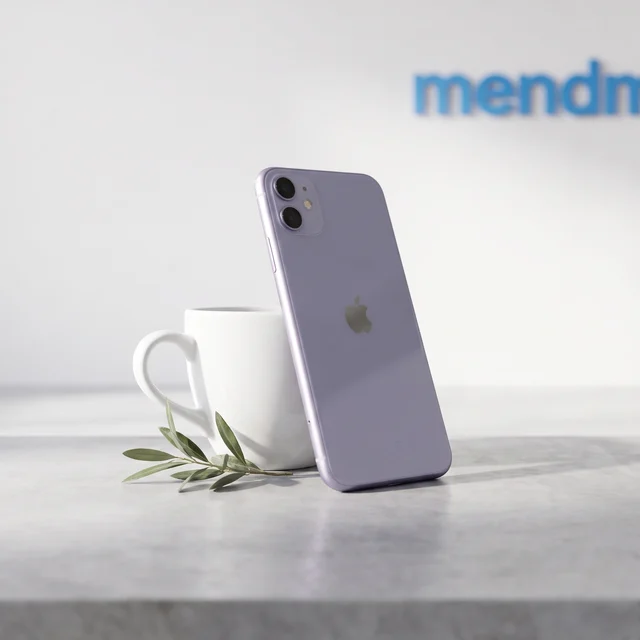 Apple iPhone 11 Purple refurbished resting on a hand, demonstrating colour and form factor