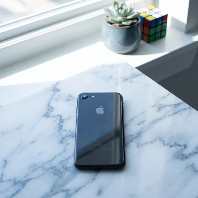 iPhone 8 in hand showcasing the sleek Space Gray aluminium design, excellent refurbished condition.