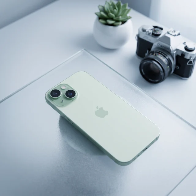 Apple iPhone 15 128GB Green in hand, lifestyle shot - Good refurbished smartphone