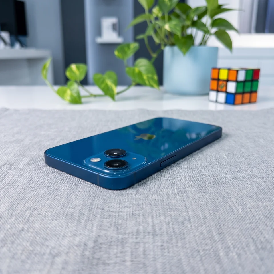 Lifestyle shot of Apple iPhone 13 Mini 128GB Blue in hand, Good refurbished, compact smartphone