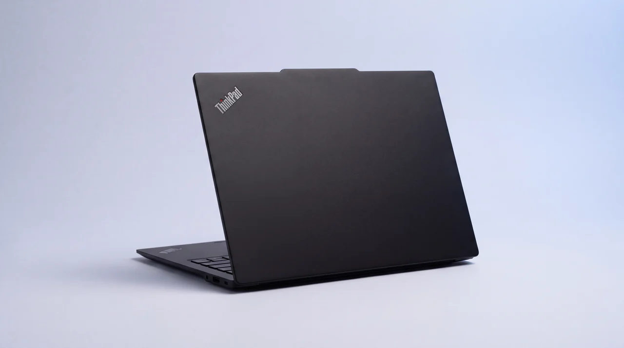 A single black laptop viewed from behind, open and pristine, ready to use