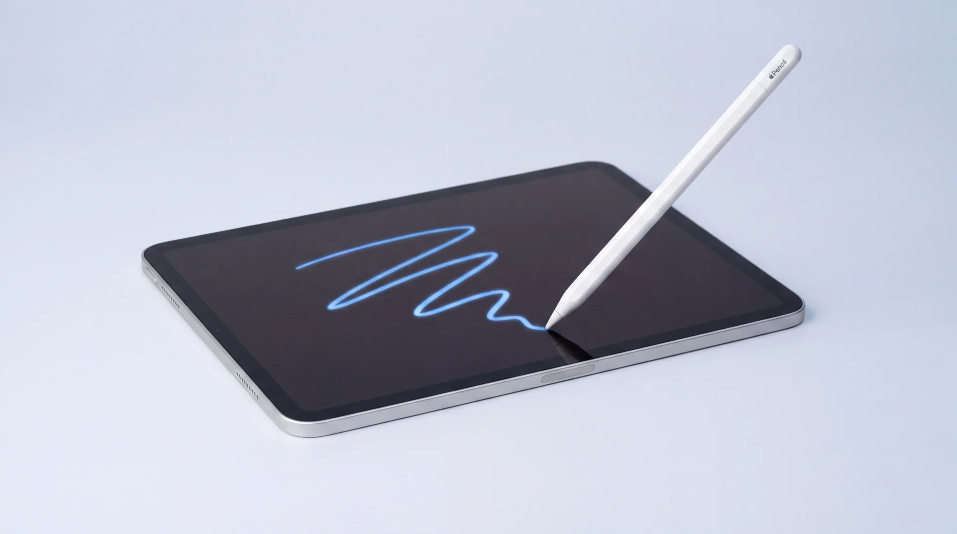 A single iPad Pro lying flat with an Apple Pencil drawing an unsteady wavy trail of blue light across its dark screen