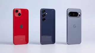 An iPhone, a Samsung Galaxy and a Google Pixel standing side by side on a clean studio surface