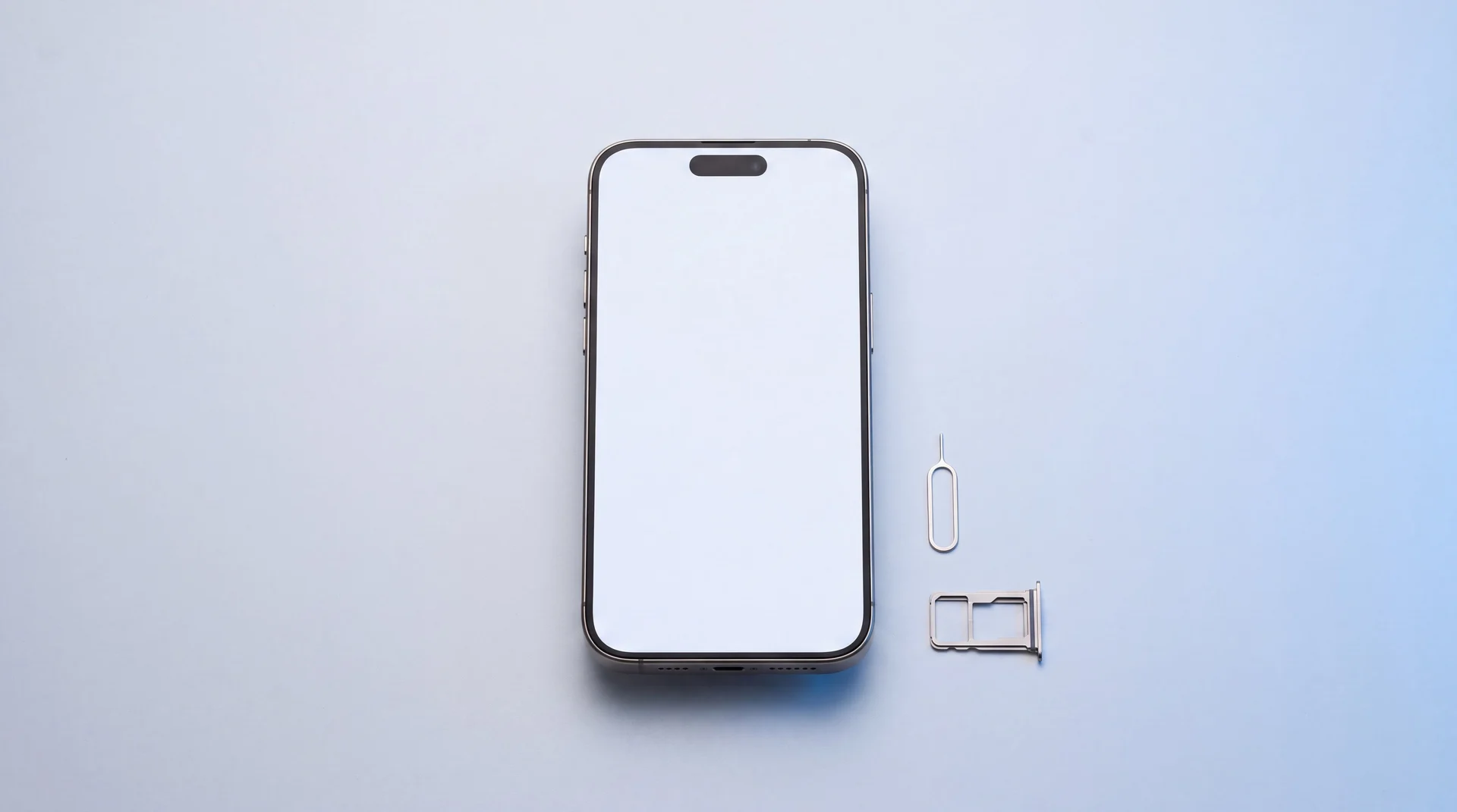 A freshly wiped iPhone with a blank screen and its ejected SIM tray, ready to sell