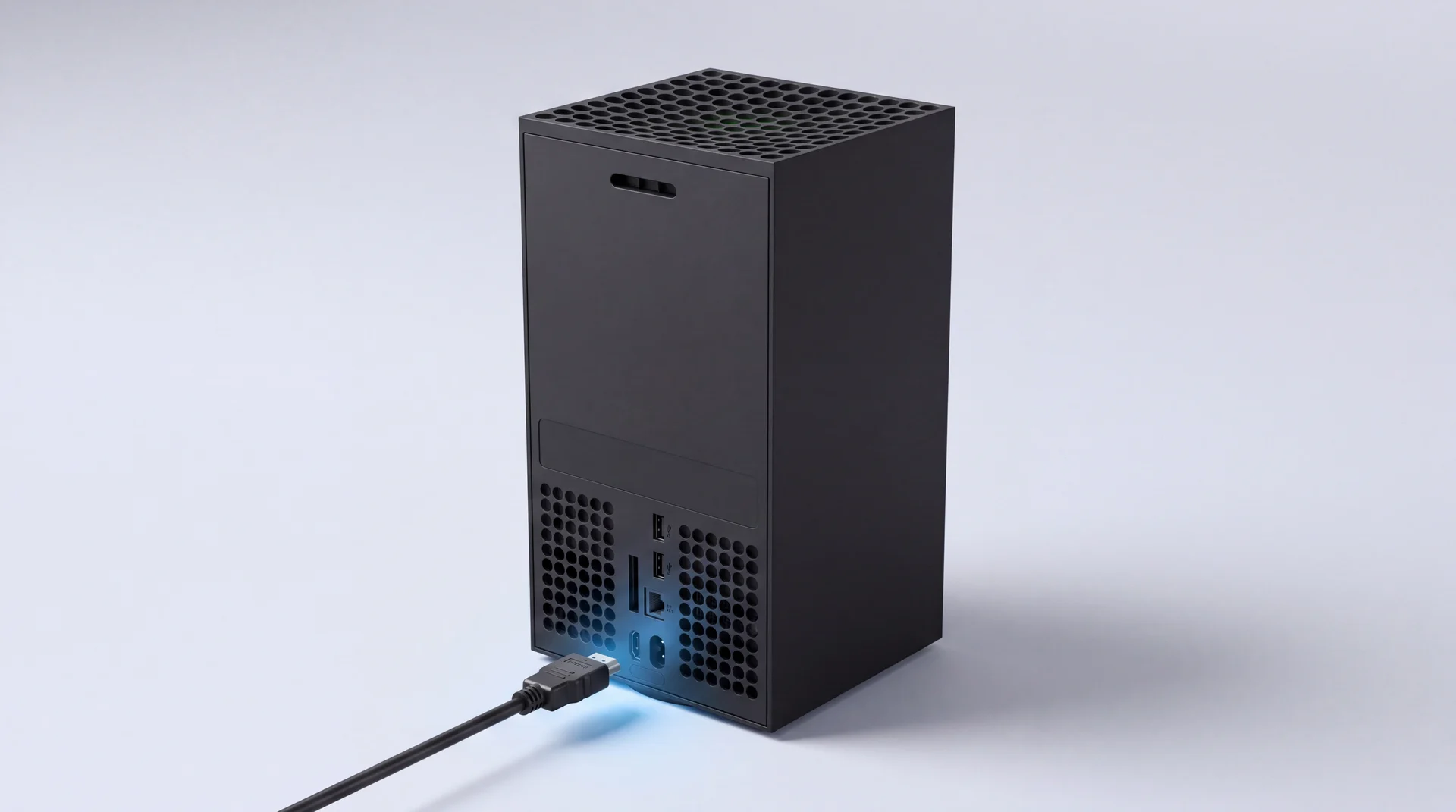 A single Xbox Series X console standing upright on a clean pale-grey studio surface with an HDMI cable connected at the base and a subtle blue glow at the connection point