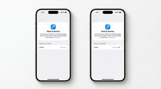 iPhone screens being compared on a clean repair workbench